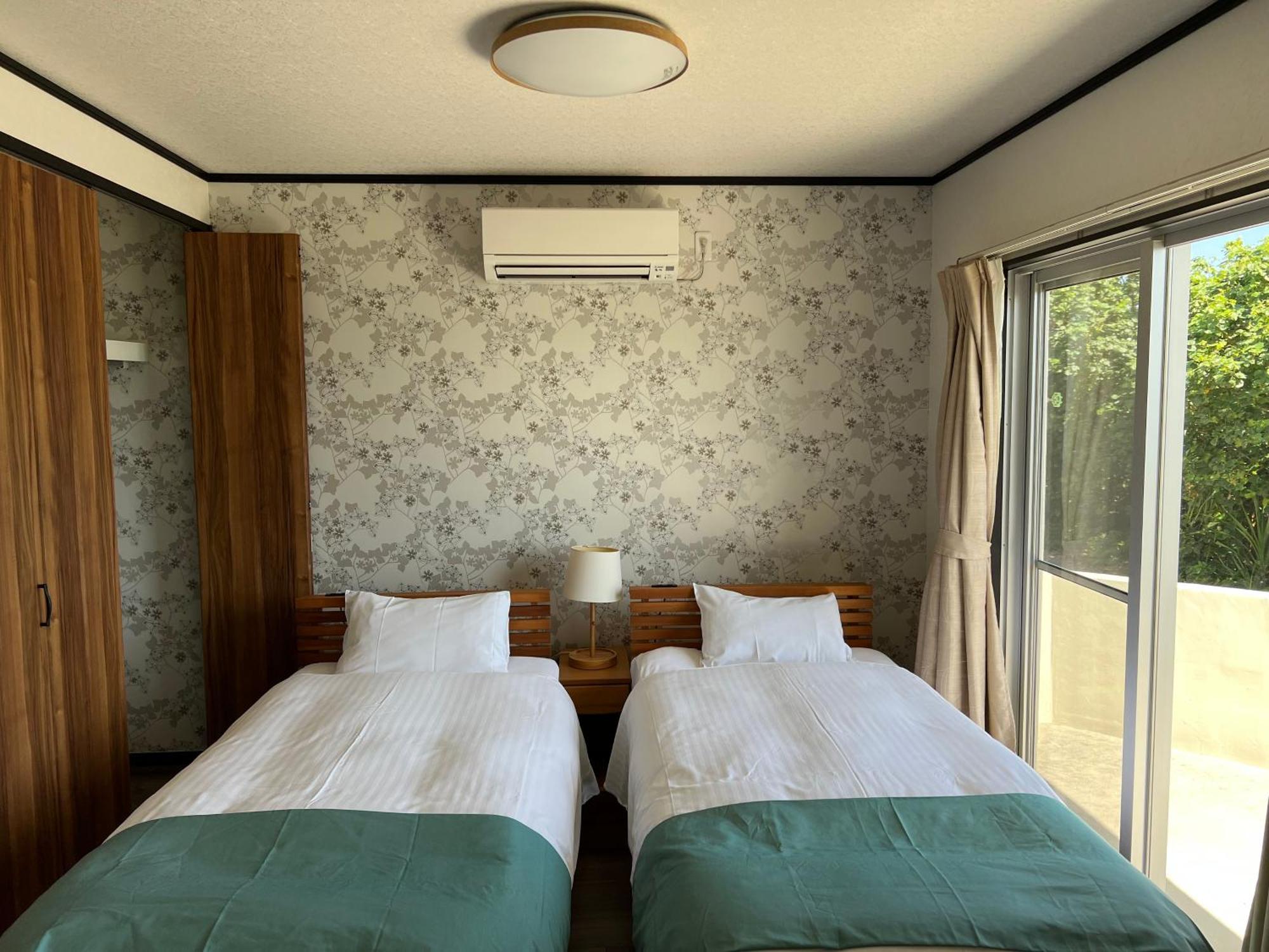Ocean Front Sumuide Apartment Nago Exterior photo